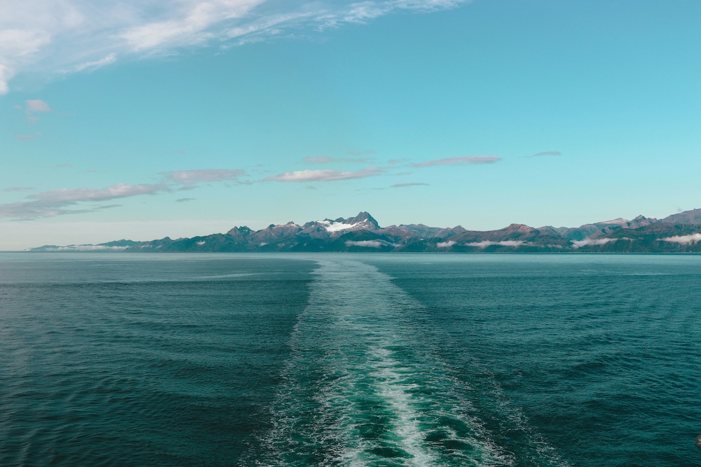 Open water with snowy mountain in the distance