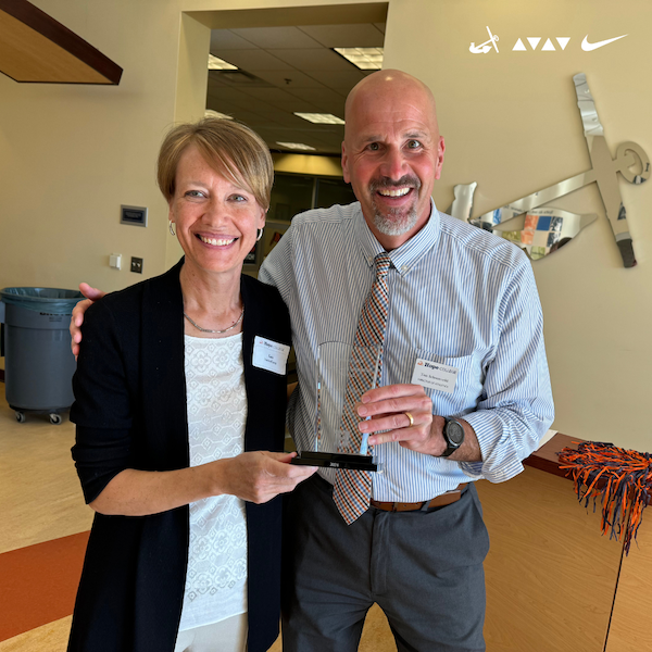 Hope for Humanity Award Recipient Kara VanderKamp ’95 with Tim Schoonveld ’96, Director of Athletics