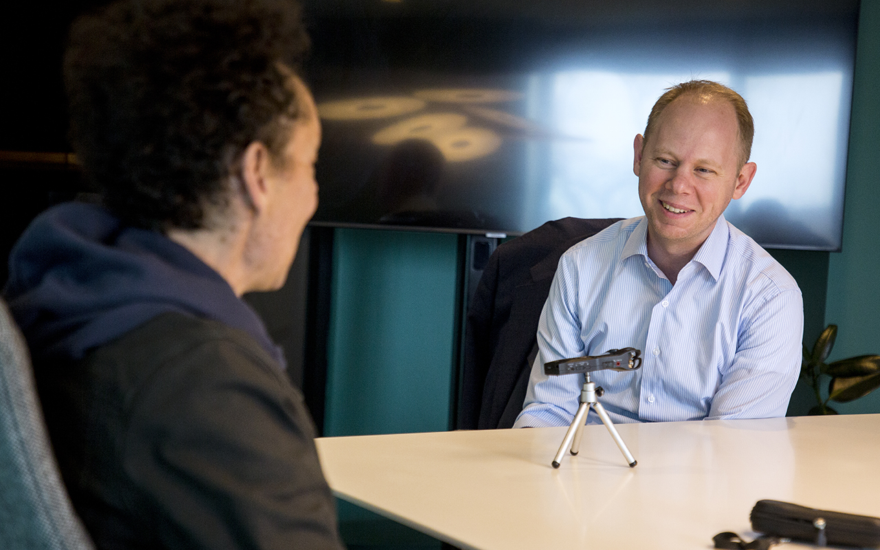 Malcolm Gladwell interviewing President Matt Scogin for the Revisionist History podcast in a studio